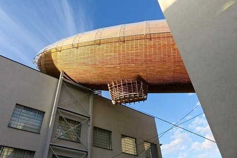 A zeppelin seems to be stranded on the DOX art gallery. In reality this is a space for events on top of the roof.