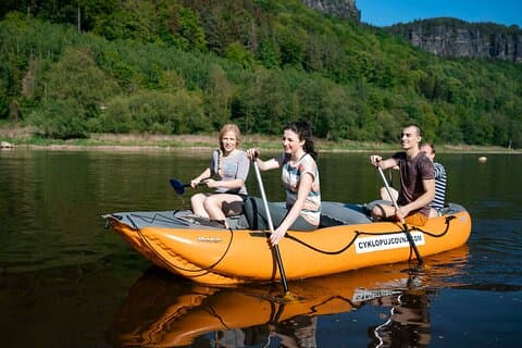 Friends having fun on a raft