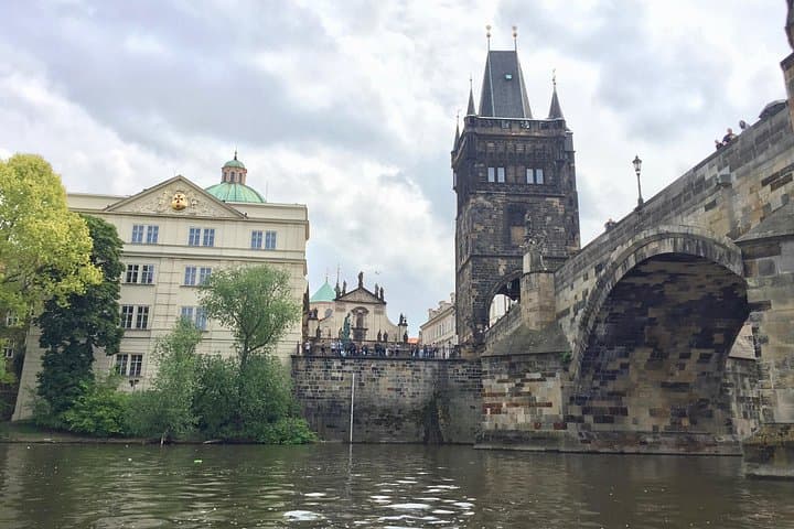 Enjoy the view of the Charles bridge and the buildings on the river banks from an unusual low angle during the cruise