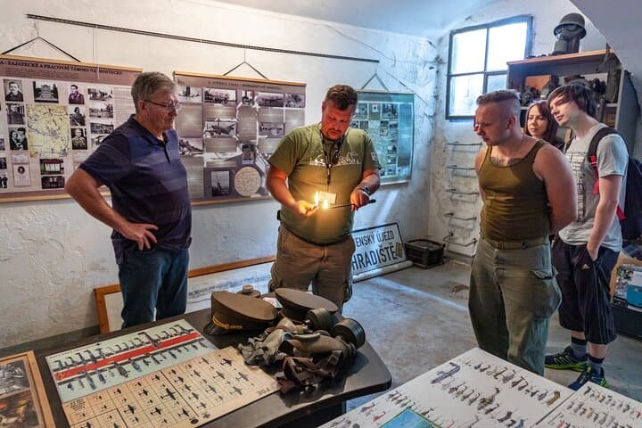 Our own bunker beneath a former textile factory—hundreds once crowded here in darkness and cold as bombs rained down. This is where the trip begins.
