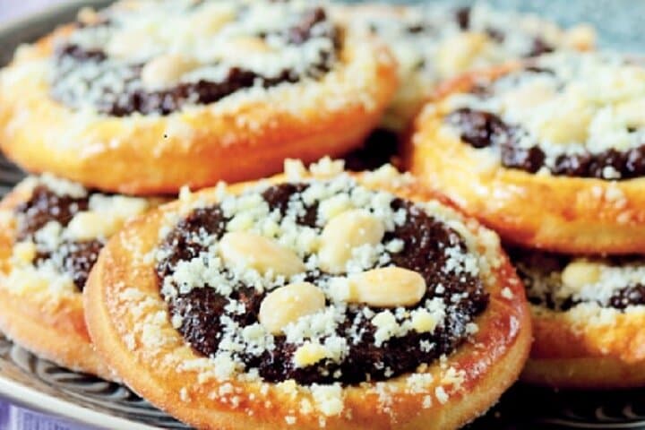 Enjoying a delicious Koláč: a sweet, traditional Czech pastry with a variety of tasty fillings