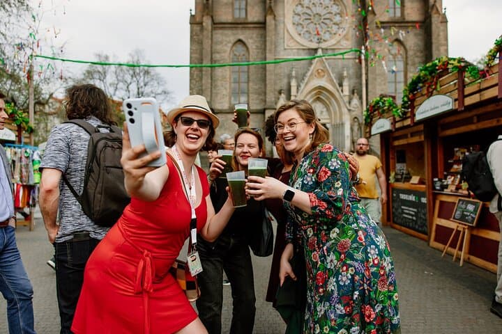 Tour guide taking a selfie with her amazing group of travelers at the local Easter markets in a residential area of Prague