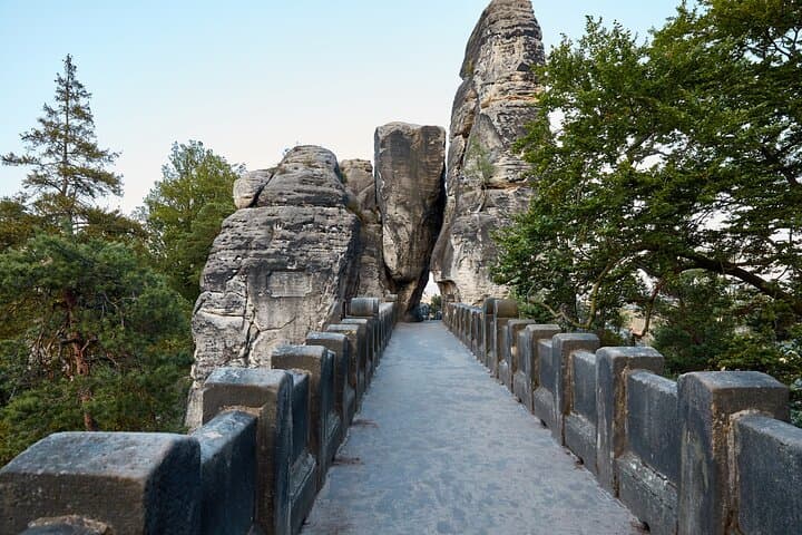 Walk across the historic stone bridge built into natural sandstone formations.