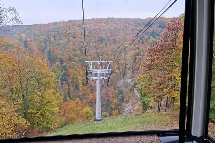A minute ride down in a Gondola = cable car to the entrance to the caves