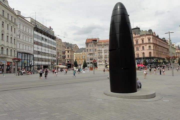 The Brno Astronomical Clock on Freedom Square — a controversial modern monument that drops a glass marble daily at 11 a.m. Locals have given it many humorous and unflattering nicknames.