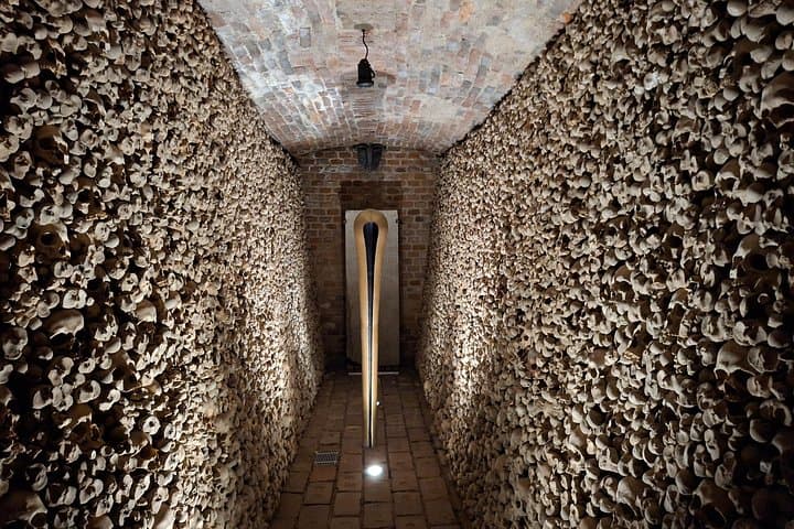 Ossuary at St. James’ Church — the second‑largest ossuary in Europe with the remains of over 50 000 people from epidemics and war, now an atmospheric underground site open to visitors.