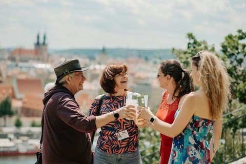 Raise a glass with fellow travelers as you toast by Prague’s iconic views.