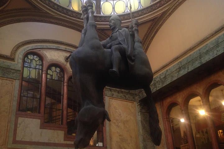 This statue is in the palace Lucerna, our mecca of pop music, designed by Vaclav Havel's grandfather. David Cerny - the contemporary artist - likes to reflect the political situation in his artwork.