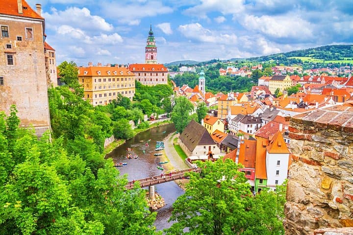 The Vltava curls gracefully through the heart of the town, wrapping around the compact maze of medieval streets and towers.