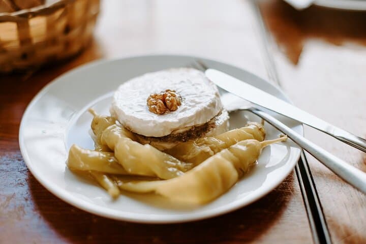 Taste Czech tradition with marinated cheese (nakládaný hermelín), a local pub favorite served with pickled peppers