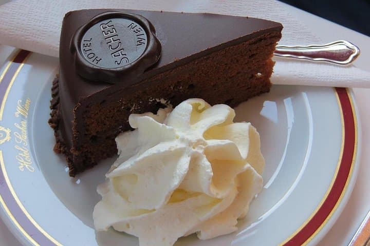 Sachertorte at Hotel Sacher – Indulge in Vienna’s most famous chocolate cake, a decadent treat that’s been delighting royalty and travelers since 1832.