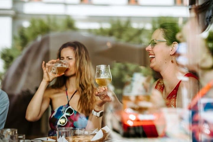 Guests enjoying the tasting of the Pilsner Urquell beer during the brewery tour.
