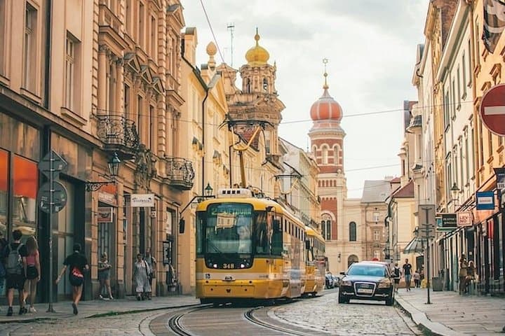 The cobblestone streets in the historic center of Pilsen with St. Bartholomew’s Cathedral in the background.